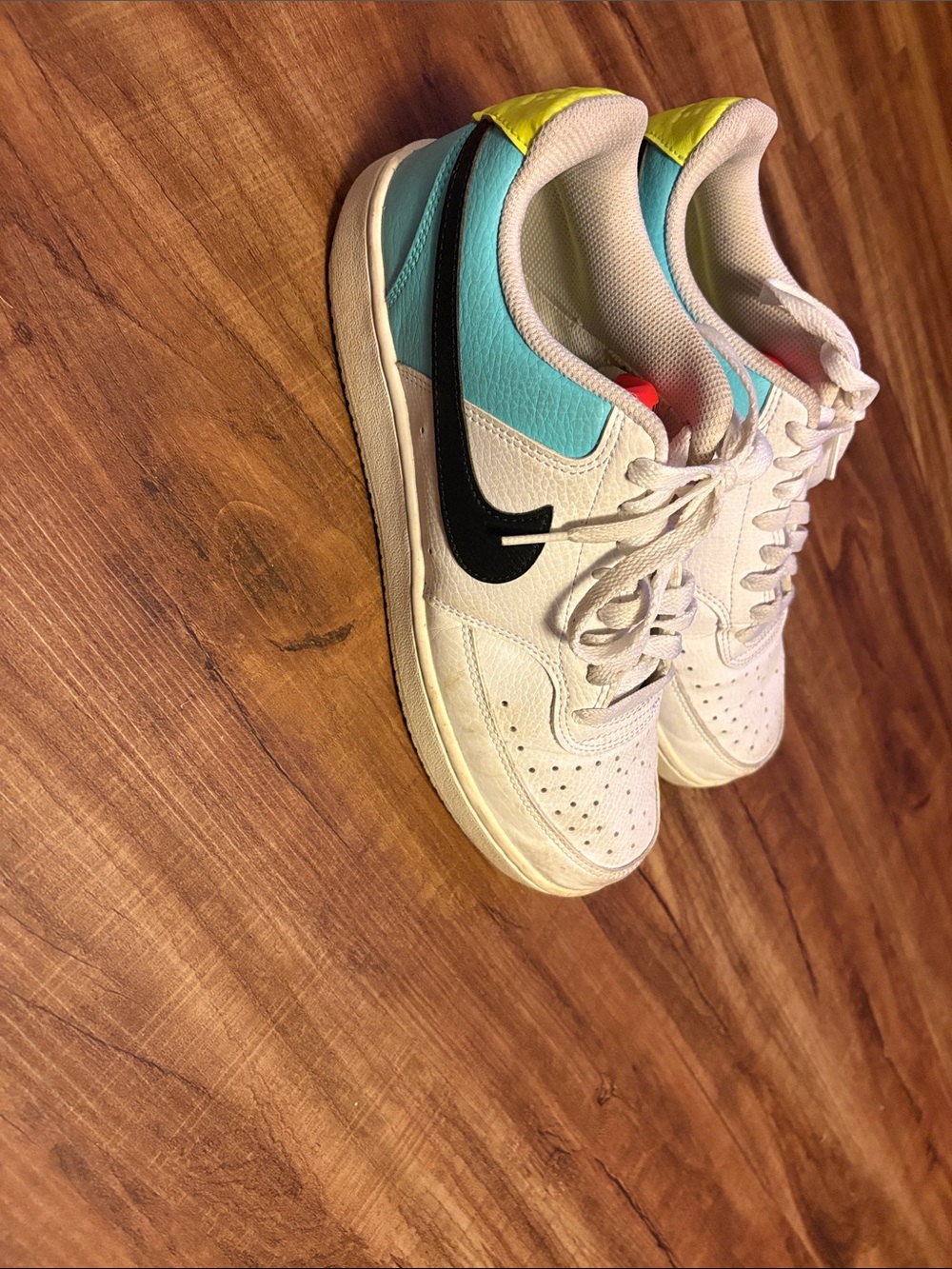 Nike Women’s White Low-Top Sneakers with Black Swoosh and Teal & Yellow Accents